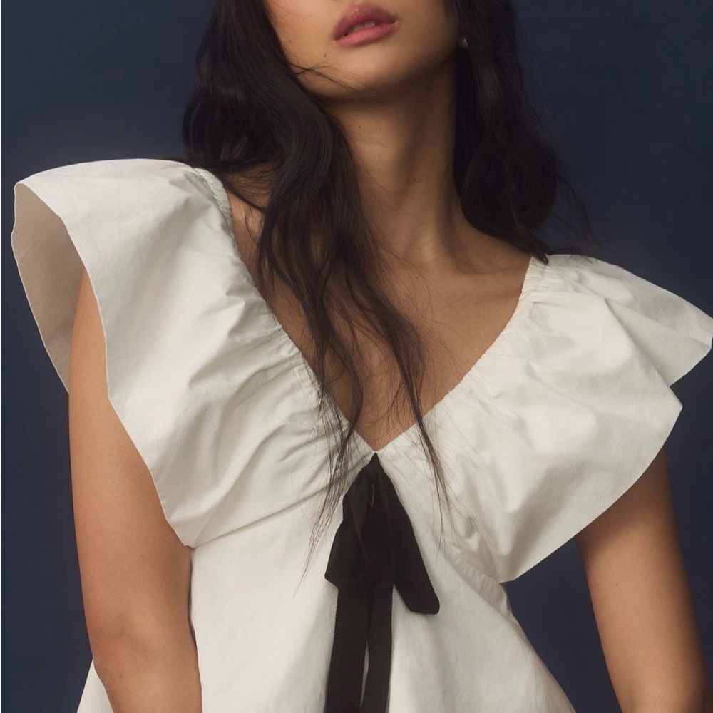 Anthropologie Bow Ruffle-Sleeve
Babydoll Blouse